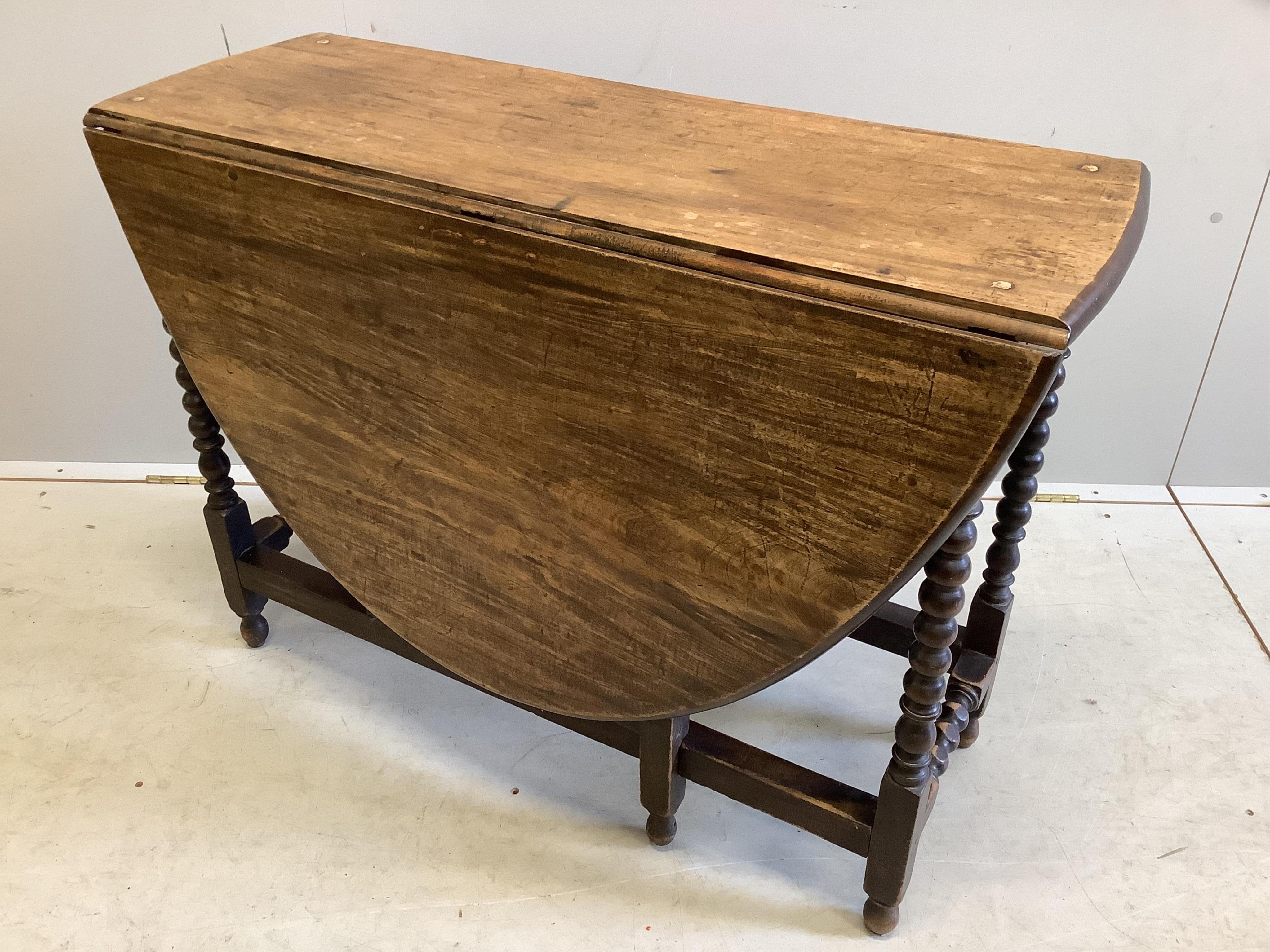 A 17th century style mahogany gate leg table, width 97cm, depth 37cm, height 72cm. Condition - fair